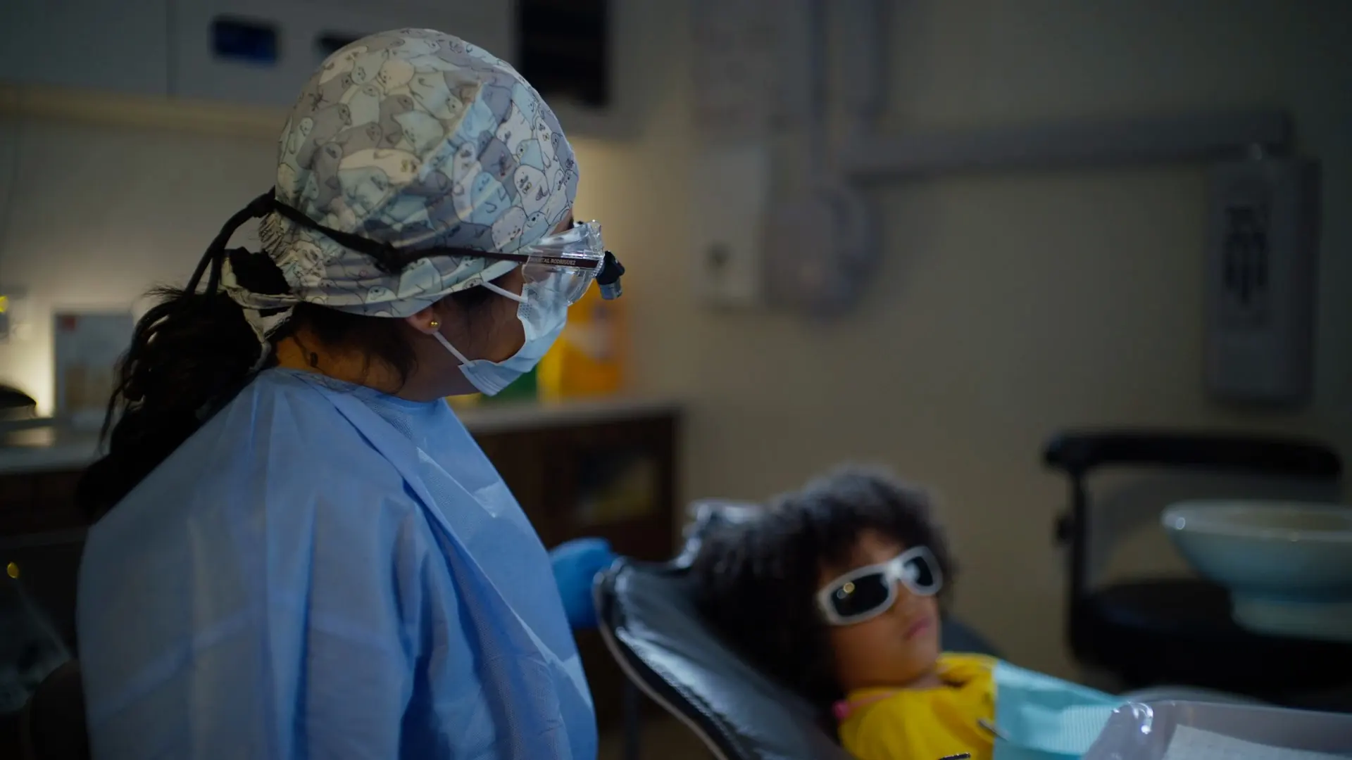 A child in the dental chair with a dentist