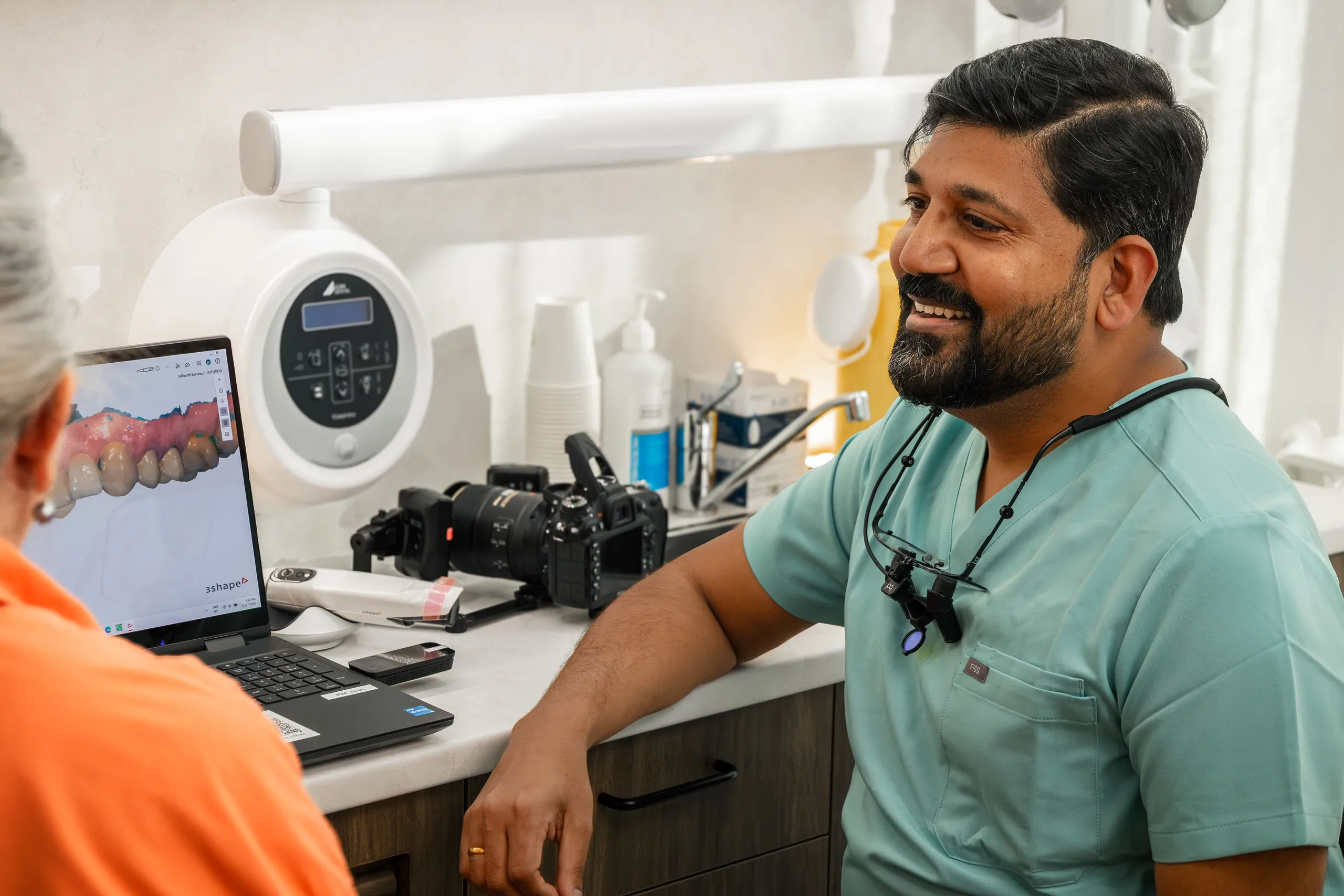 Dentist discussing denture options with a patient at Dental Embassy, Braddon