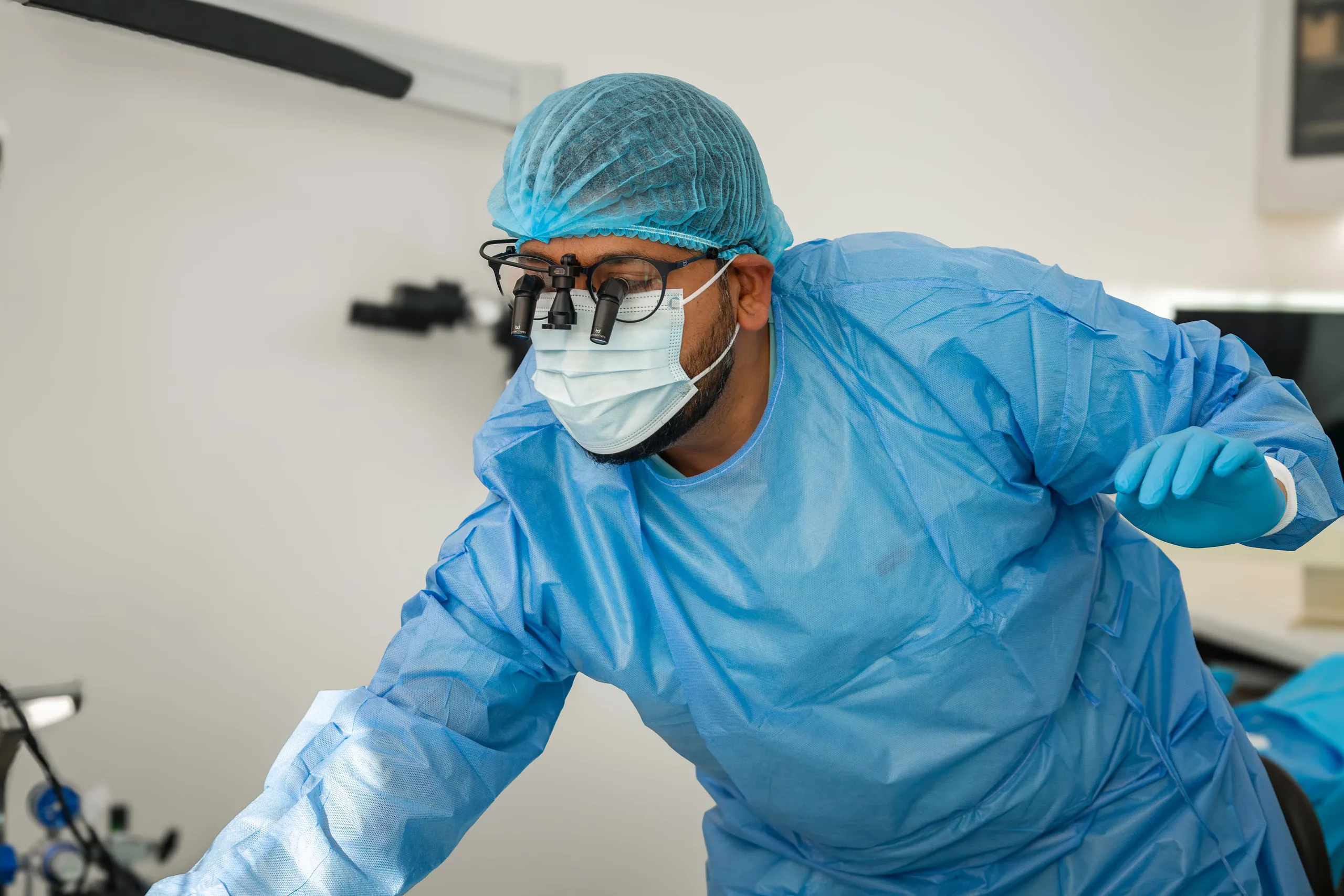 Dental operating microscope positioned over a treatment chair at Dental Embassy, Braddon
