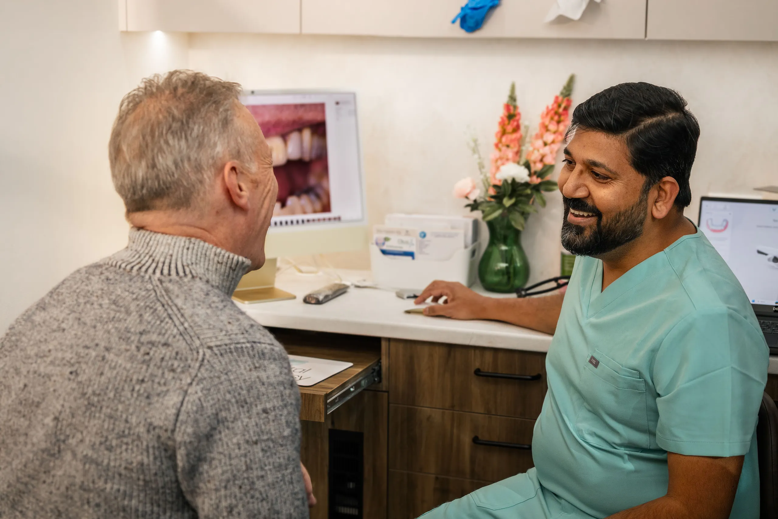 Discussing a written treatment plan and costs at Dental Embassy, Braddon