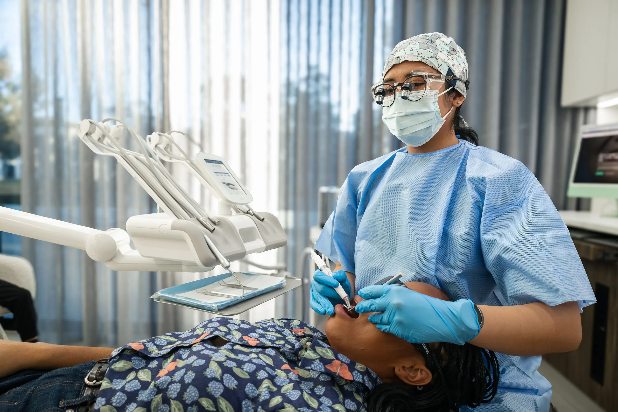 Dentist explaining root canal treatment to a patient at Dental Embassy, Braddon