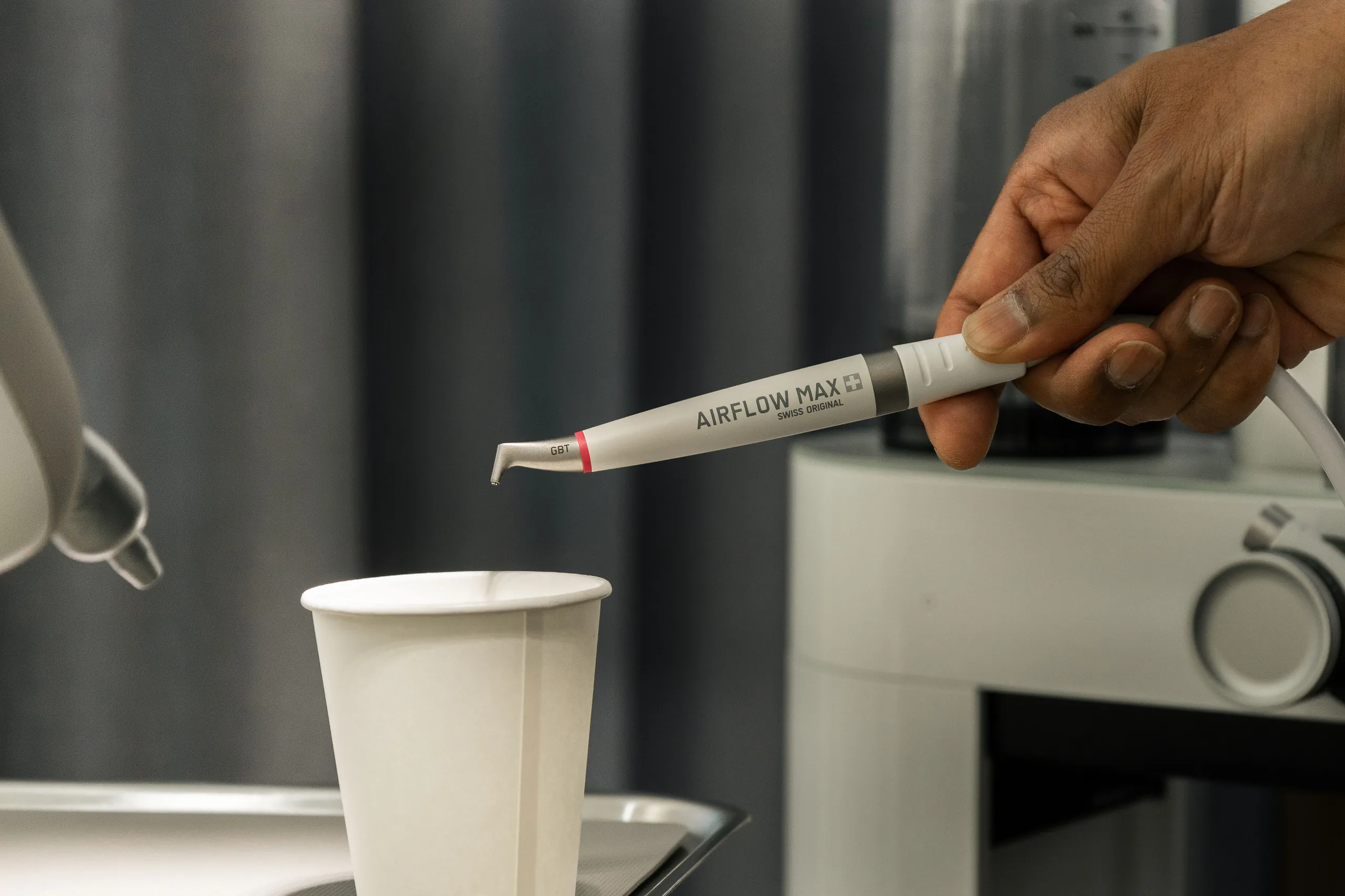 Dentist checking the margin of an existing crown at a routine appointment in Braddon, Canberra